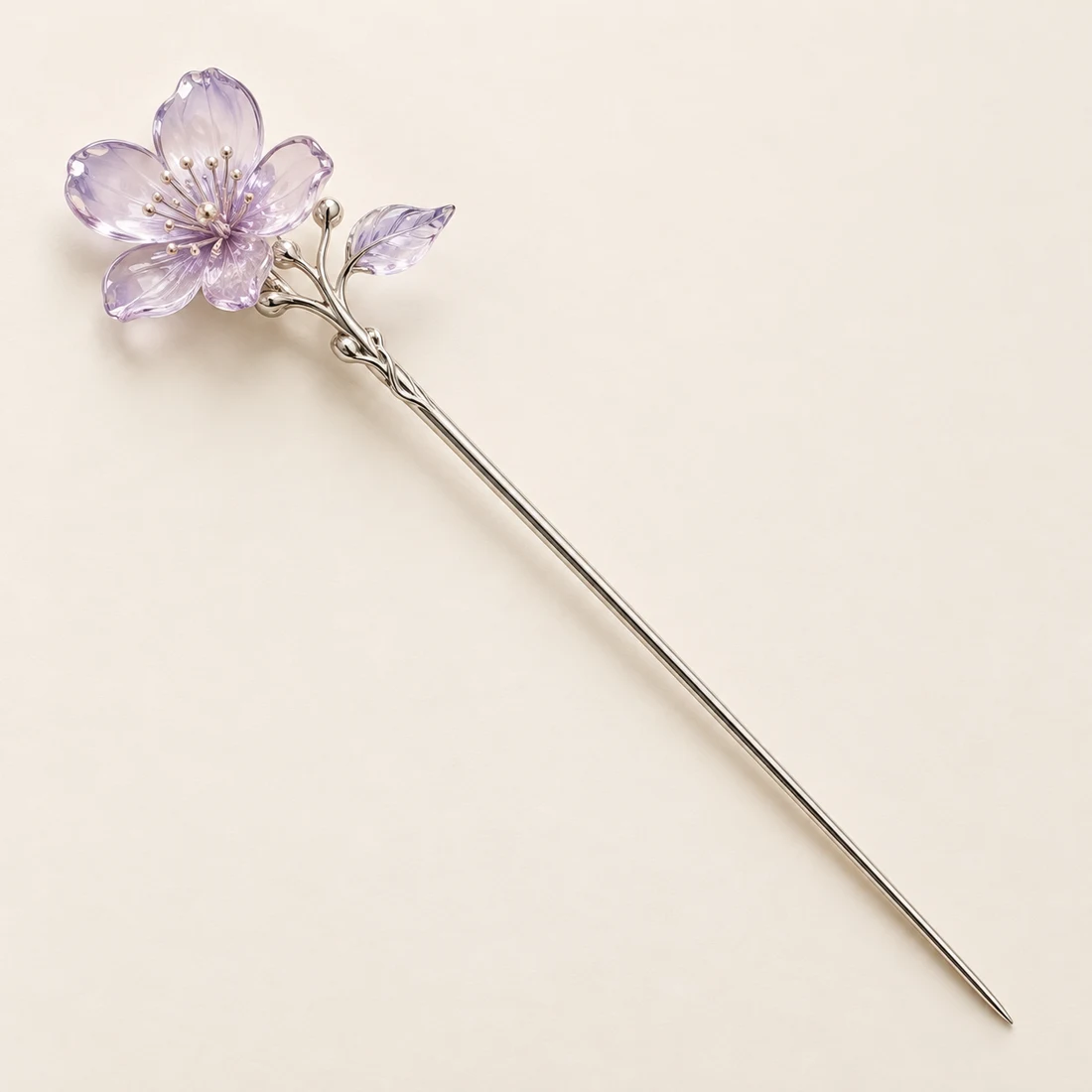 Lilac Whisper Hairpin: a soft lilac blossom with a small leaf, silver-tone shaft