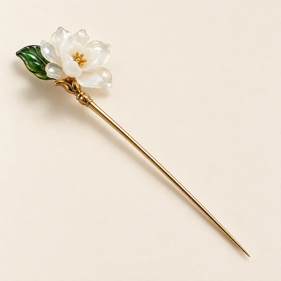 Gardenia Nocturne Hairpin: a milky-white gardenia with dark green leaves, gold-tone shaft